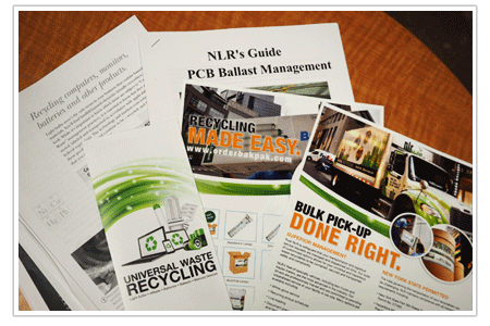 A picture of several handouts and fliers pertaining to recycling universal waste. NLR provides businesses with resources to help them understand universal waste recycling and our services.