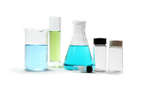 A picture of flasks and beakers typically found in a lab. NLR can perform lab packs for chemicals.